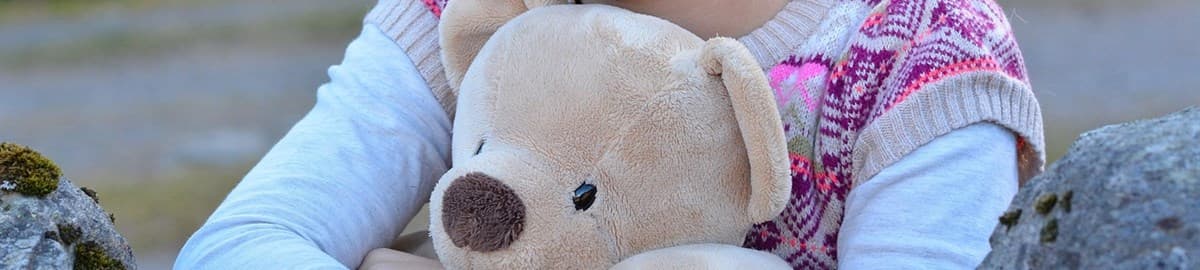 Child hugging a teddy bear: WWD on Natalia Vodianova backing Soula