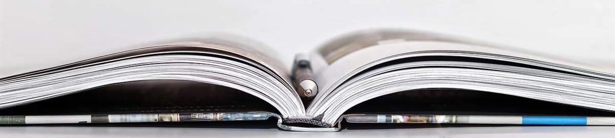 Open notebook on a white surface: Starter Story interview with the founder of Soula